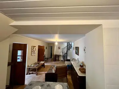 a living room with a couch and a table at Villa with Mountain view, São Vicente, Madeira in São Vicente