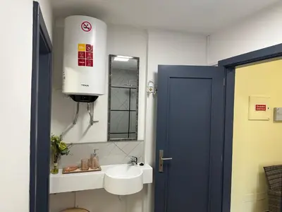 a bathroom with a sink and a mirror at Xanda Escape in Machico