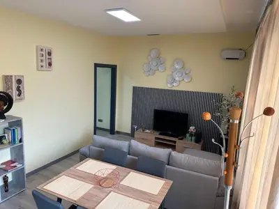 a living room with a couch and a table at Xanda Escape in Machico