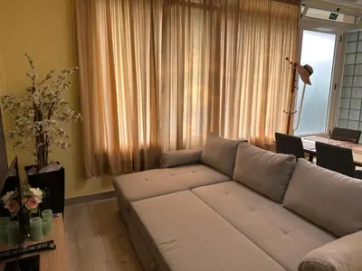 a living room with a couch and a table at Xanda Escape in Machico