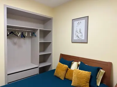 a bedroom with a bed and a closet at Xanda Escape in Machico