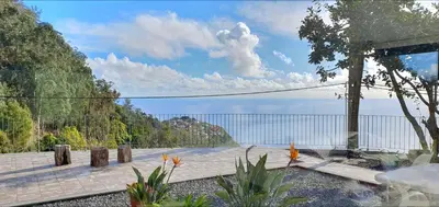 a patio with a view of the water at Casa Avós & Netas, Fantastic View, Near the Nature! in Arco da Calheta