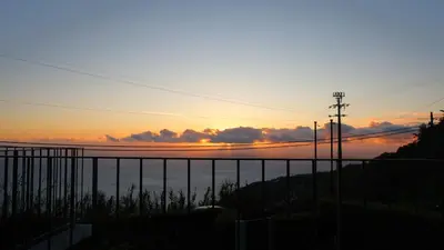 a view of the sunset from a balcony at Casa Avós & Netas, Fantastic View, Near the Nature! in Arco da Calheta