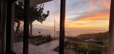 a view of a sunset from a house window at Casa Avós & Netas, Fantastic View, Near the Nature! in Arco da Calheta