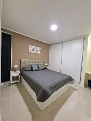 a bedroom with a large bed in a room at Atlantic Garden Santa Luzia 44 in Funchal