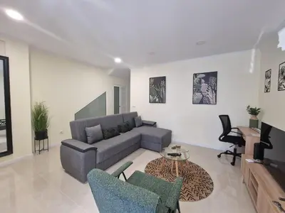 a living room with a couch and a table at Atlantic Garden Santa Luzia 44 in Funchal