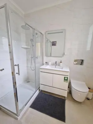 a bathroom with a shower and a sink and a toilet at Atlantic Garden Santa Luzia 46 in Funchal