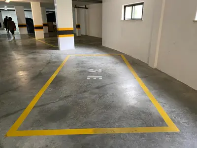 a room with yellow lines on the floor of a building at Seaview apartment Estrela da Luz Praia da Luz in Luz
