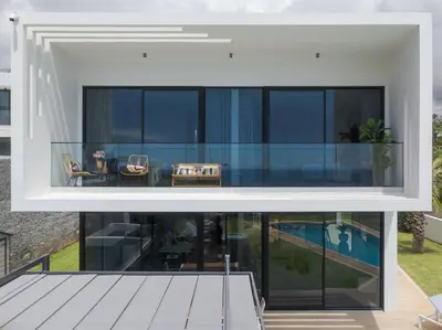 an extension of a house with glass walls at Luxury Diamond House by Holiday Rental Madeira in Funchal