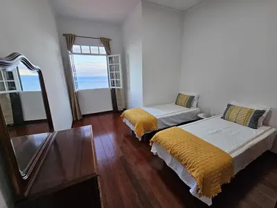 a bedroom with two beds and a window at The View in Santa Cruz