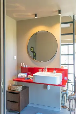 a bathroom with a sink and a mirror on the wall at Doca Seca & Casca de Uva in Porto Moniz