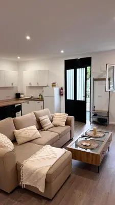 a living room with a couch and a table at Revived in Porto da Cruz