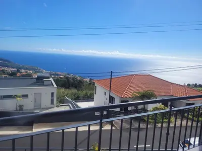 a view of the ocean from a balcony at Linda Paisagem in Calheta