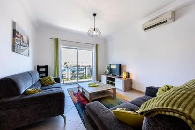 a living room with two couches and a table at Boa Vista - Fairview Island in Lagos