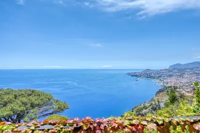 a view of the amalfi coast from positano at Casa das Bromélias, a Home in Madeira in Funchal