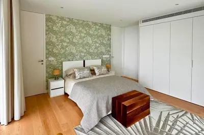a bedroom with a bed and a rug at Cardais Paradise View in São Vicente