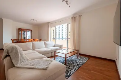 a living room with a couch and a table at Madeira Sunny Penthouse in Funchal