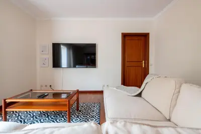 a living room with a couch and a coffee table at Madeira Sunny Penthouse in Funchal