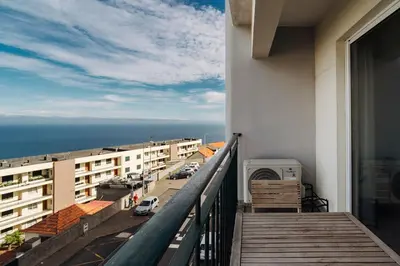 a view of the ocean from a building at GuestReady - Lovely Getaway in Caniço in Caniço