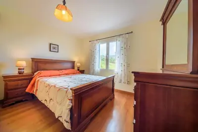 a bedroom with a large bed and a window at Gabriel Loft by MTH in Ponta do Sol