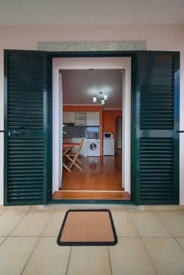 a room with an open door to a kitchen at Gabriel Loft by MTH in Ponta do Sol