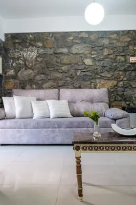 a living room with a purple couch and a table at GuestReady - Delight Getaway in Madeira in Machico