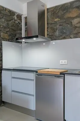 a kitchen with a white counter top in a room at GuestReady - Delight Getaway in Madeira in Machico