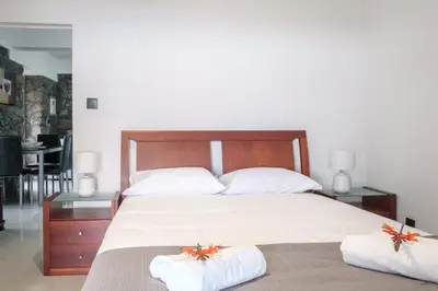 a bedroom with a large bed with two pillows at GuestReady - Delight Getaway in Madeira in Machico