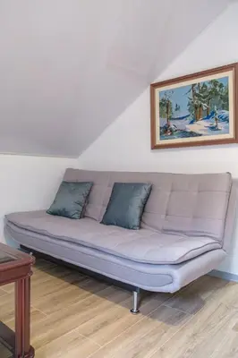 a couch in a room with a picture on the wall at GuestReady - Delight Getaway in Madeira in Machico