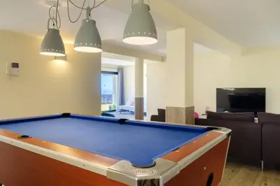 a living room with a pool table in it at GuestReady - Funchal Sunny Retreat in Funchal