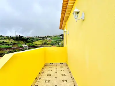 a balcony with a view of the ocean at Casa Amarela by Your Madeira Rentals in Ponta do Sol