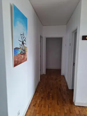 an empty room with a painting on the wall at Casa da Avó Teresa in Porto Santo
