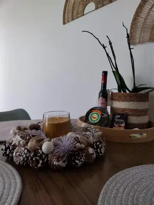 a tray with a candle and a drink on a table at Funchal Casa in Funchal