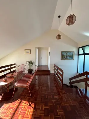 a living room with a table and chairs at Funchal Casa 2 in Funchal