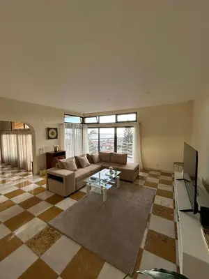 a living room with a couch and a table at Funchal Casa 2 in Funchal