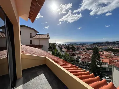 a balcony with a view of a city at Funchal Casa 2 in Funchal