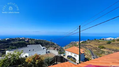 a view of the ocean from a house at Rustic Calheta House in Arco da Calheta