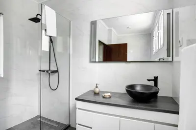 a bathroom with a black sink and a shower at Casa Caminho do Palheiro - Funchal in Funchal