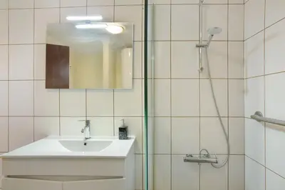 a bathroom with a sink and a shower at Levada Residence in Funchal