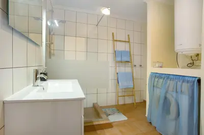 a bathroom with a sink and a shower at Levada Residence in Funchal