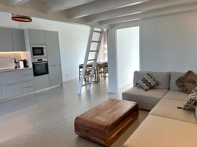 a living room with a couch and a table at Casa Castelejo in Bordeira