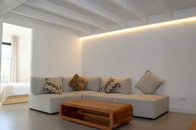 a living room with a couch and a coffee table at Casa Castelejo in Bordeira