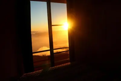 a view of the sun rising over a sea of clouds at Madeira Native Motion Guest House in Fajã da Ovelha
