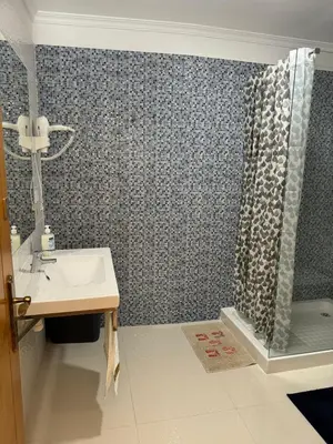 a bathroom with a sink and a shower at Old Zone Apartments 1A in Funchal