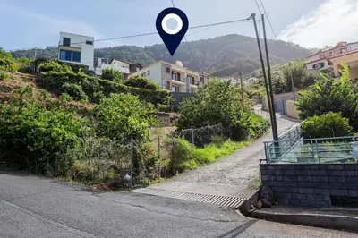 a street sign on the side of a road at Machico Oasis in Machico