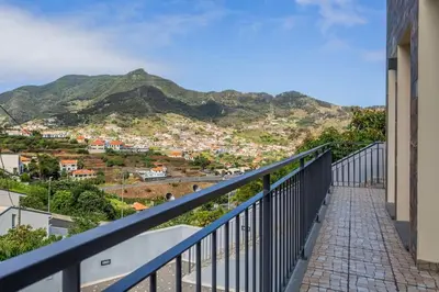 a balcony with a view of a mountain at Machico Oasis in Machico