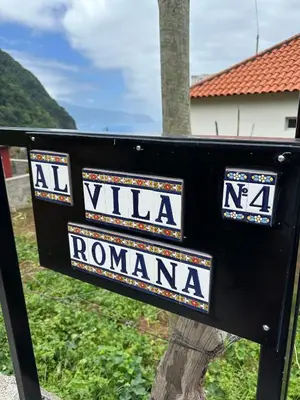 a black sign that says villa roma at Vila Romana in São Vicente
