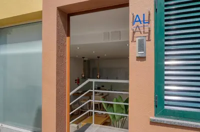 a large window of a building with a balcony at Seashell, a Home in Madeira in Machico