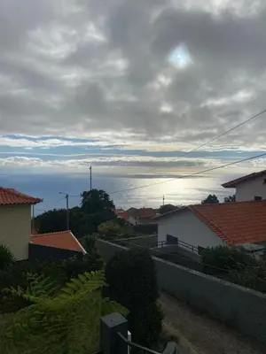 a view of the ocean from the roof of a house at Guest House Santinhos in Estreito da Calheta