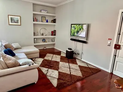 a living room with a couch and a tv at Apartment Minorca in Funchal